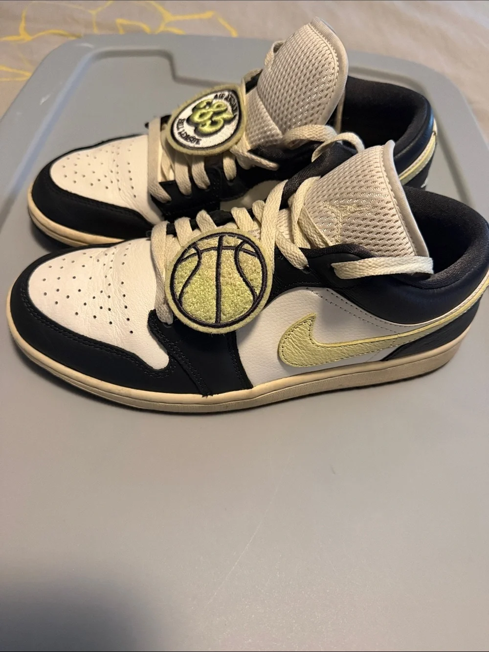 Nike Air Jordan 1 Low in White, Black and Cream/Yellow Accents